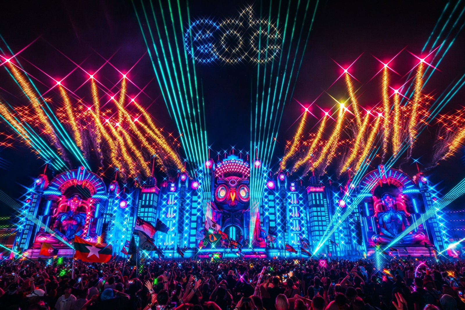 EDC kineticFIELD main stage at night with lasers and fireworks over the crowd