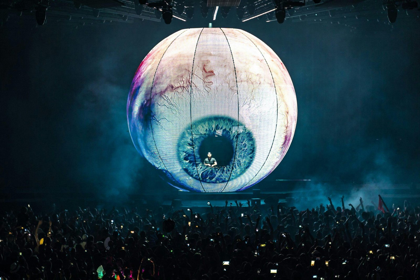 Eric Prydz performing inside his spherical LED stage production above an arena crowd