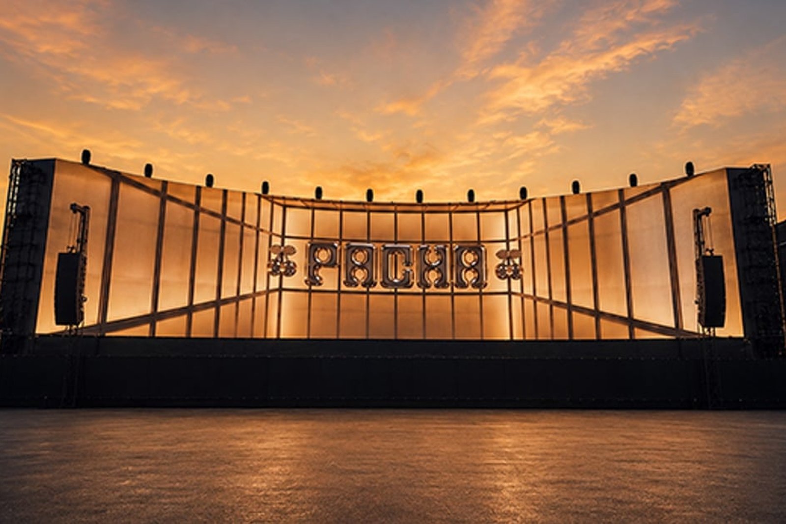 Pacha New York open-air stage at sunset with the cherries logo at center stage