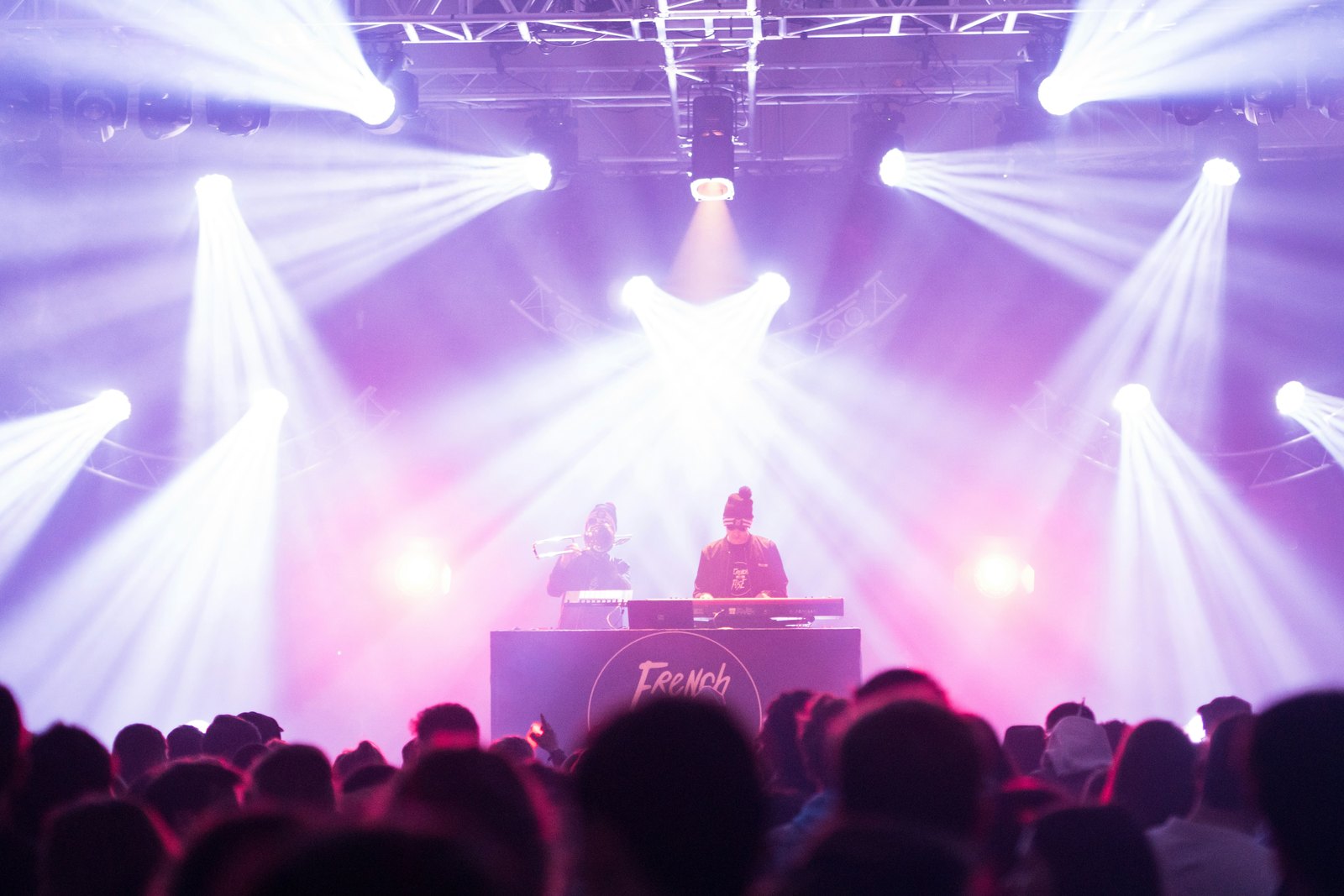 A DJ playing a set in front of a crowd