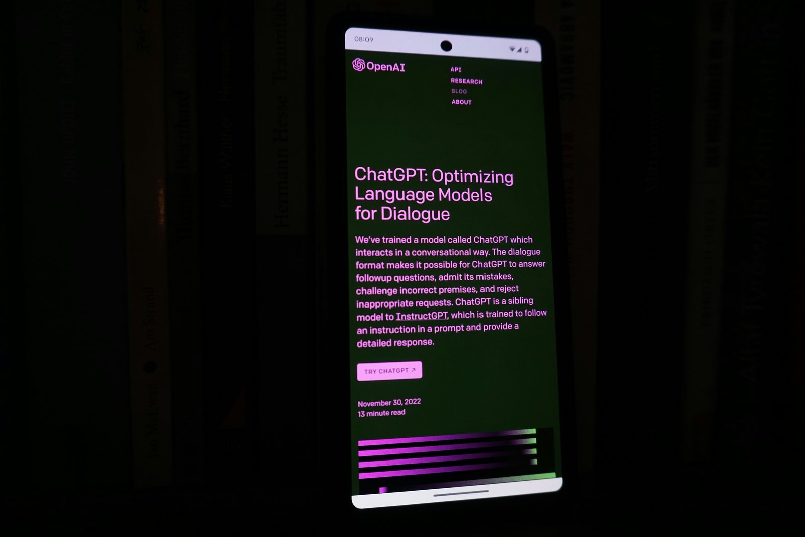 A smartphone with a lit-up screen in a dark room
