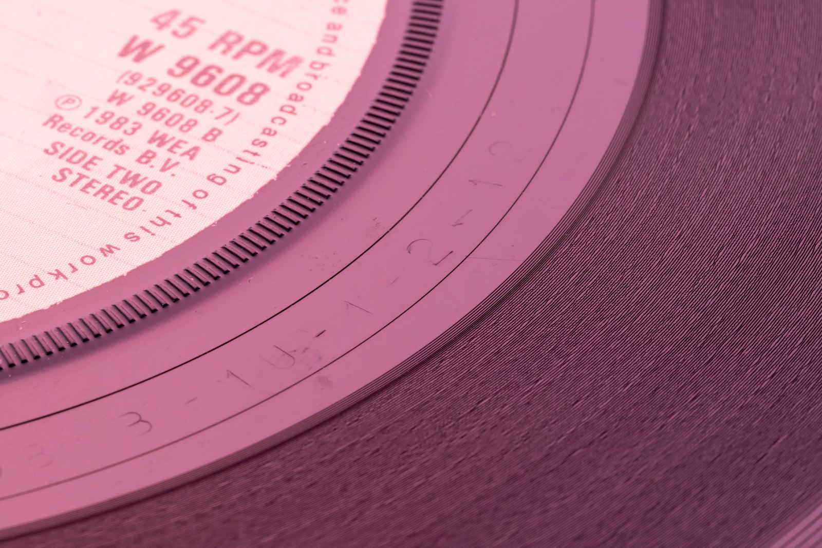 A close-up of the centre label of a black vinyl record